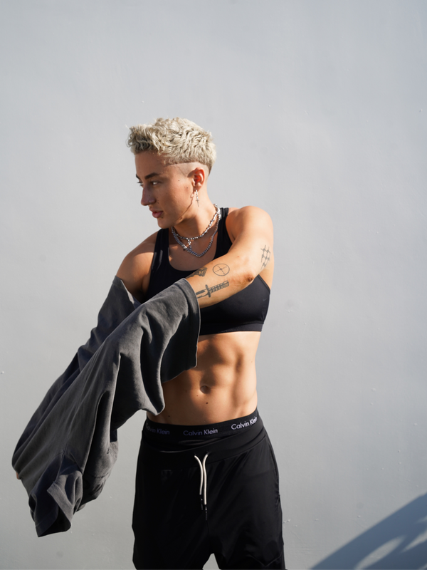 Morgan taking shirt off to reveal Sydney sports bra from SBA