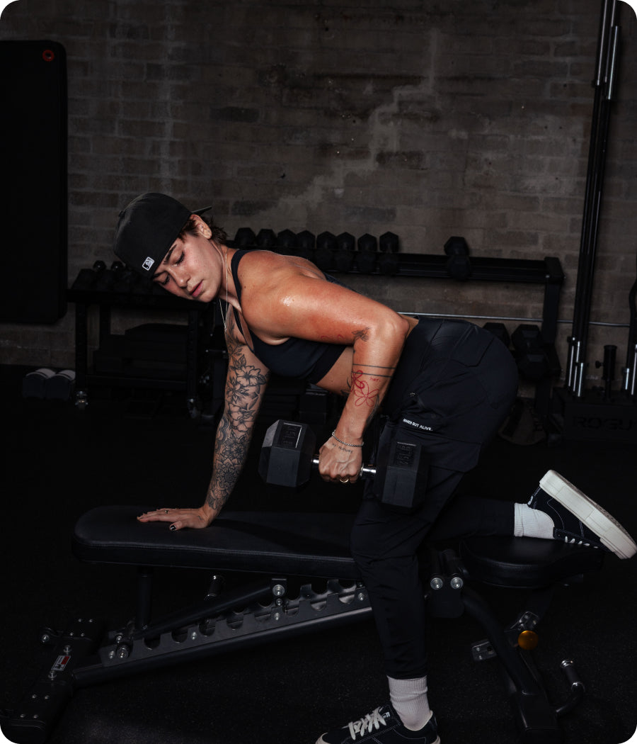Model doing single arm dumbbell row